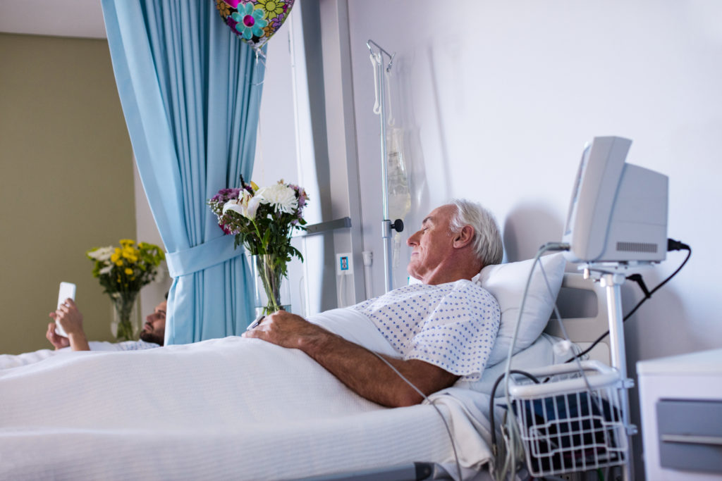 Male senior patient relaxing in the ward at hospital